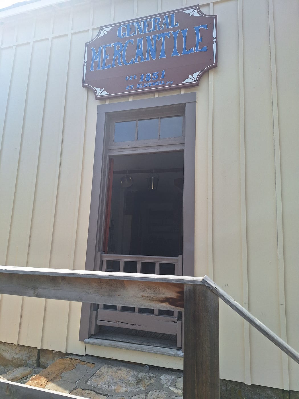 A sign on the outside of the building saying “General Mercantile” est. 1851